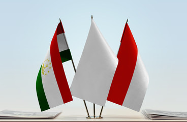 Flags of Tajikistan and Indonesia with a white flag in the middle