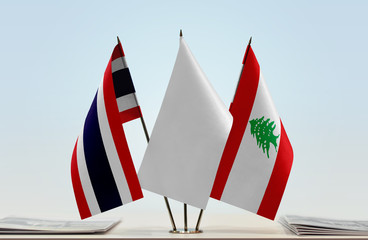 Flags of Thailand and Lebanon with a white flag in the middle