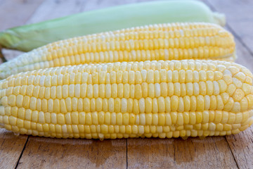 Sweet corn on wood table.