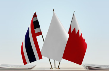 Flags of Thailand and Bahrain with a white flag in the middle