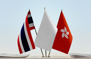 Flags of Thailand and Hong Kong with a white flag in the middle