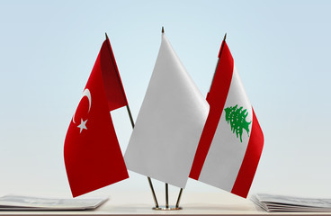 Flags of Turkey and Lebanon with a white flag in the middle