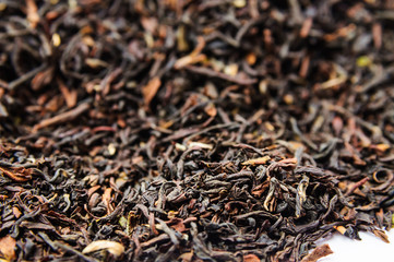 Background of dry black tea with flavors