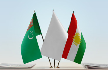 Flags of Turkmenistan and Kurdistan with a white flag in the middle