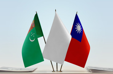 Flags of Turkmenistan and Taiwan with a white flag in the middle