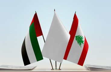Flags of UAE and Lebanon with a white flag in the middle