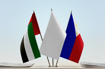 Flags of UAE and Philippines with a white flag in the middle