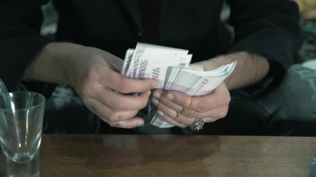 Male hands counting cash. Illegal trades 4K