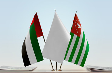 Flags of UAE and Abkhazia with a white flag in the middle