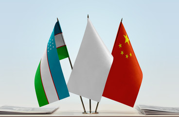 Flags of Uzbekistan and China with a white flag in the middle