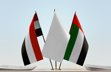 Flags of Yemen and UAE with a white flag in the middle