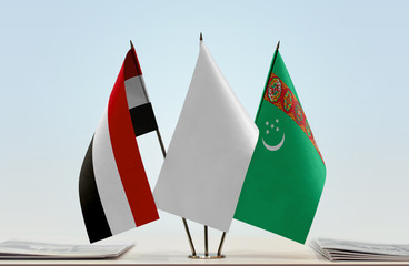 Flags of Yemen and Turkmenistan with a white flag in the middle