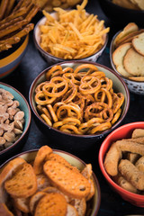 Salty snacks served in bowls