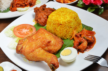 Biryani rice  with fried chicken drumstick and egg    