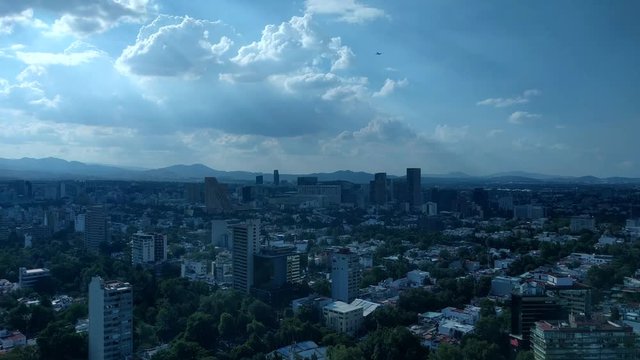 Polanco, Mexico City. Daytime, aerial view. Airplane flies over head.