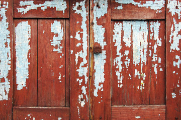 Doors of an old wooden cabinet. Background with shabby painted boards