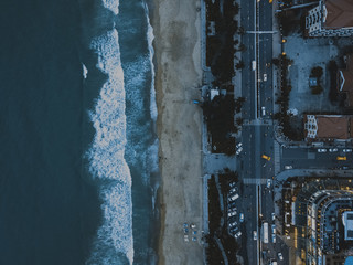 drone view of the busy city by the beach