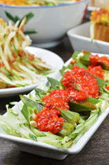 Malaysian cuisine - Okra with spicy sauce on white plate