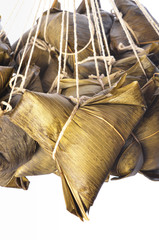 A bunch of steamed rice dumpling hanging isolated on white  background        