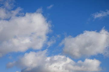 Naklejka na ściany i meble White clouds floating in the blue sky
