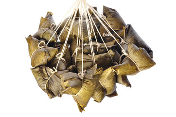 A bunch of steamed rice dumpling hanging isolated on white  background        