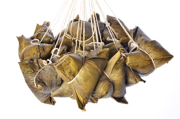 A bunch of steamed rice dumpling hanging isolated on white  background        