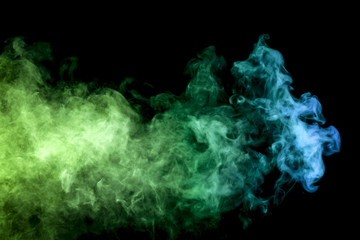 .Colorful blue and  green smoke clouds on dark background.Background of smoke vape.