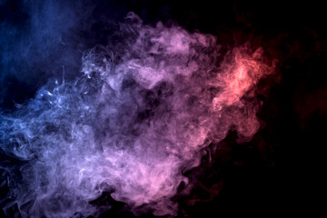 Cloud of smoke of purple, red and blue colors on black  isolated background. Background from the smoke of vape