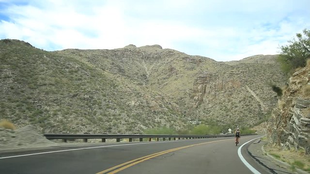 Passing a bicycle on a mountain road. 