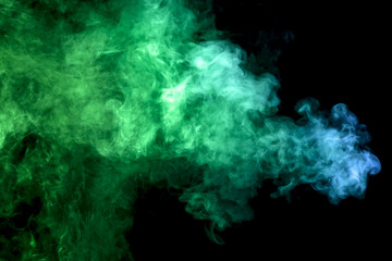 .Colorful blue and  green smoke clouds on dark background.Background of smoke vape.