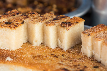 Myanmar traditional dessert divided into pieces for sale made from sticky rice