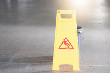 Sign showing warning of caution wet floor at airport.