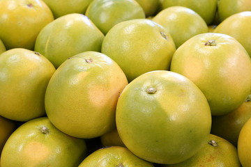 Close up on fresh grapefruit in pile