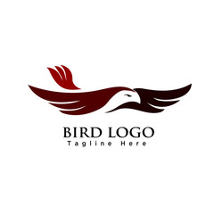 Flying bird on sky logo