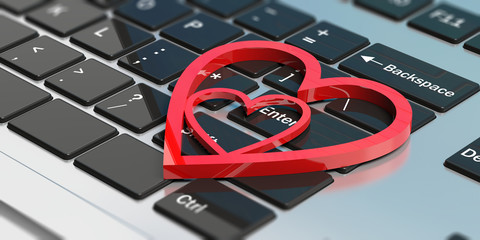 Online dating. Red attached hearts on a computer keyboard. 3d illustration