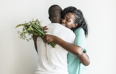 African descent couple hugging each other