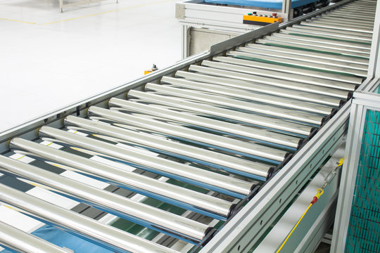 The Conveyor Chain, And Conveyor Belt On Production Line Set Up In Clean Room Area.