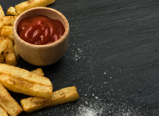 French Fries with Ketchup on Dark Background