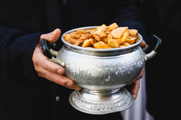 Hand Holding a Nimki or Namkin Bowl