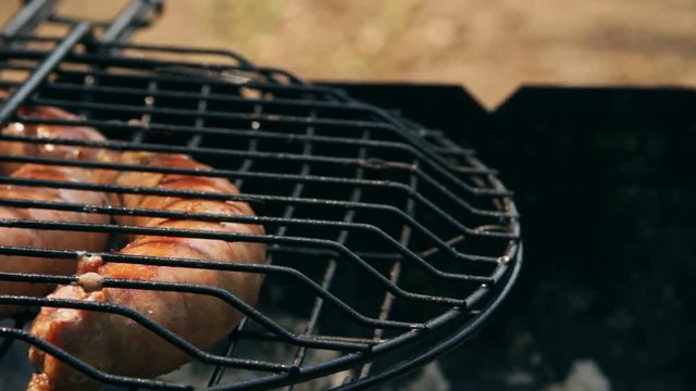 Grilled sausages on bbq. Variety Original Nuremberg Rostbratwurst . Pork ground meat, dill, nutmeg, garlic, cardamom, marjoram in the natural gut. There are also other types: rostbratwurst, currywurst