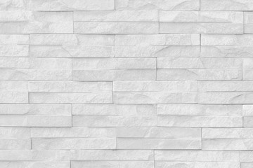 Fototapeta premium Surface white wall of stone wall gray tones for use as background.