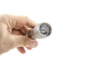 Small home pocket led flashlight in hand on the white