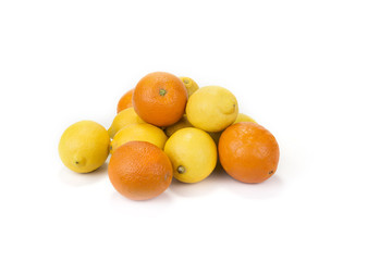 Fresh oranges and lemons on the white background