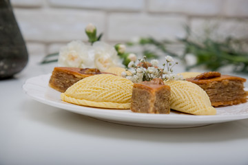 A plate with national pakhlava and shekarbura as Novruz symbol