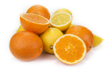 Fresh oranges and lemons on the white background