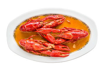 Crayfish in sauce. The main ingredients are cooked craysfish, onion,  pepper, garlic, tomato,  bay and olive oil. White isolated. Top view.