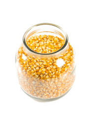 jar of dried corn isolated on white background