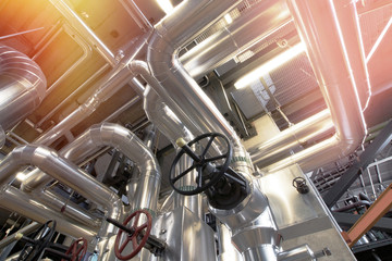 different size and shaped pipes and valves at a power plant