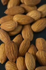 almonds on black surface