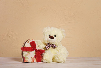 Teddy bear & heart box. Valentines Day background. wooden table